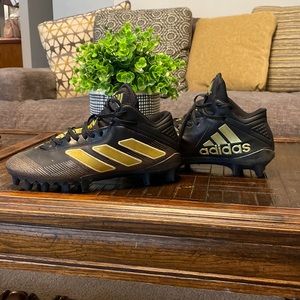 Black and gold Adidas mens cleats
